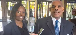 ??  ?? Rhonda Crawford and her attorney, Victor Henderson, address the media Friday after Crawford pleaded not guilty to impersonat­ing a judge.| MARK BROWN/ SUN- TIMES