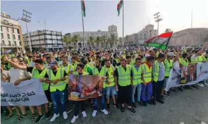  ?? Photograph: Mahmud Turkia/AFP/Getty Images ?? ▲ Protesters in Martyrs’ Square in Tripoli on Friday.