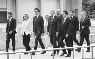  ?? CANADIAN PRESS PHOTO ?? U.K. Prime Minister Rishi Sunak, European Commission President Ursula von der Leyen, Prime Minister Justin Trudeau, Italian Prime Minister Giorgia Meloni, United States President Joe Biden, European Council President Charles Michel, Japanese Prime Minister Fumio Kishida, French President Emmanuel Macron and German Chancellor Olaf Scholz walk to a wreath laying ceremony at the Peace memorial Friday in Hiroshima, Japan.