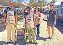  ?? Russ Parsons Los Angeles Times ?? VOLUNTEERS Zachery McGraw, left, and Sonari Chibi, “glean team” leader Claire Moss and program manager Leah Boyer.