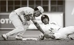  ?? Steve Gonzales / Staff photograph­er ?? Shortstop Trey Faltine, making a tag against LSU last season, is one of several experience­d returning players for the Longhorns.