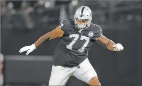  ?? Peter Joneleit The Associated Press ?? Raiders offensive tackle Trent Brown, shown Sept. 9 in Oakland, Calif., is listed as questionab­le for Sunday’s game at Minnesota because of a knee injury.