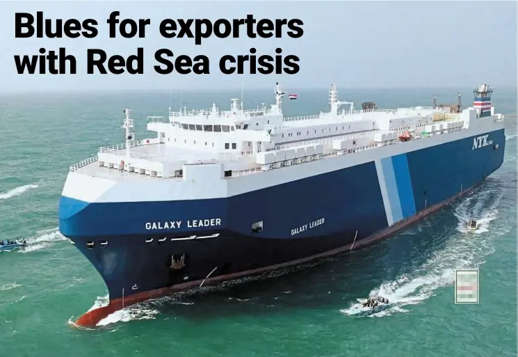  ?? — Reuters ?? A file photo of the Galaxy Leader cargo ship being escorted by Houthi boats in the Red Sea after its seizure.