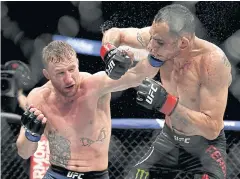  ?? AFP ?? Justin Gaethje, left, on his way to beating Tony Ferguson.