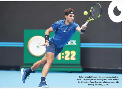  ??  ?? Rafael Nadal of Spain hits a return during his men’s singles quarter-final against John Isner of the US at the China Open tennis tournament in Beijing on Friday. (AFP)