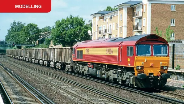  ??  ?? Foster Yeoman PTA (JUA/JTA) wagons are trundled through Kensington Olympia behind EWS Class 59 No. 59206 Pride of Ferrybridg­e in June 2003. The wagons are finished in the ‘Big Y' version of Foster Yeoman livery together with a liberal coat of grime, stone dust and rust.