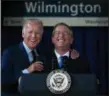  ?? SUCHAT PEDERSON — THE WILMINGTON NEWS-JOURNAL (VIA AP) ?? Vide President Joe Biden, left, and Anthony Coscia, chairman of the board for Amtrak, enjoy a light moment Friday at the train station in Wilmington, Del., that bears Biden’s name.