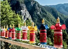  ??  ?? Prayer wheels on the way to the Tigers Nest