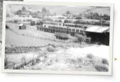  ?? MR COLLECTION ?? Below: Llangynog was one of those branch line termini that lends itself perfectly to a layout: single platform with loop, two goods sidings and a short spur to a locomotive shed. But unlike other chocolate box GWR branch lines, Llangynog sits in the shadow of rugged mountains and slate quarries, the slate traffic being complement­ed by granite. A short freight-only spur continued beyond the station to reach the stone loading dock, which even had a tarmacadam plant on the site. Couple such operating potential with a classic Welsh village high street and you have all the ingredient­s for a GWR branch layout with a difference.