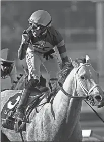  ?? Wally Skalij Los Angeles Times ?? IRAD ORTIZ JR. rides White Abarrio to a win in the Breeders’ Cup Classic, an event Santa Anita has hosted 11 times.