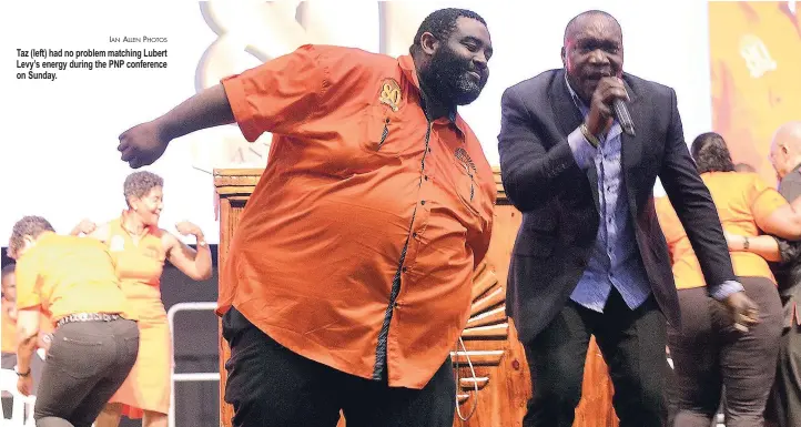  ?? IAN ALLEN PHOTOS ?? Taz (left) had no problem matching Lubert Levy’s energy during the PNP conference on Sunday.