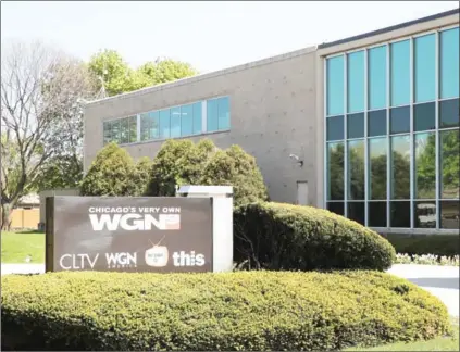  ?? SCOTT OLSON/GETTY IMAGES/AFP ?? A sign sits outside Tribune Media Company’s WGN television studio on Monday in Chicago. Tribune Media Co has announced it has agreed to be acquired by Sinclair Broadcast Group for $43.50 per share, or about $3.9 billion. Sinclair currently owns 173...