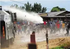  ?? Reuters ?? Controllin­g the crowd A water cannon is used by riot policemen to disperse protesters in the capital Bujumbura yesterday.