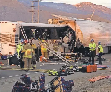  ?? COLIN ATAGI, THE DESERT SUN ?? A tour bus and big rig collided on Interstate 10 near Palm Springs, Calif., on Sunday.