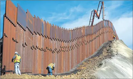  ?? Picture: MARIO TAMA/Getty ?? DEEP DIVISIONS: Sections of the wall are installed but Congress is refusing the President’s call for £4.5billion