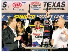  ?? JARED C. TILTON / GETTY IMAGES ?? Driver Carl Edwards celebrates with Texas Motor Speedway President Eddie Gossage (left) after winning NASCAR’s Texas 500 at Texas Motor Speedway last November.