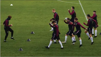  ??  ?? Wexford FC coach Jason Goodison (left) conducting the pre-match warm-up.