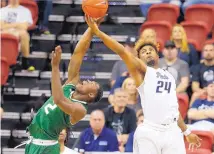  ?? ISAAC BREKKEN/ASSOCIATED PRESS ?? Colorado State’s Emmanuel Omogbo, left, and Nevada’s Jordan Caroline vie for a rebound during the first half of the MWC championsh­ip game.