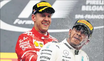  ?? GETTY ?? ▪ Sparks are set to fly with Ferrari’s Sebastian Vettel (background) and Mercedes’ Lewis Hamilton setting their goals for the season.