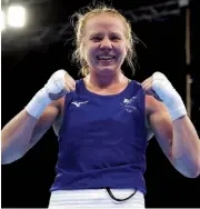  ?? ?? IN BLOOM: Rosie Eccles of Wales celebrates securing bronze with a win over Lovina Borgohain