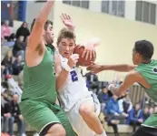  ?? DAVE KALLMANN / MILWAUKEE JOURNAL SENTINEL ?? Brookfield Central guard Gage Malensek finds his path to the basket blocked by Matt Hickey.