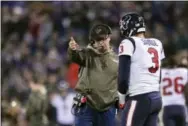  ?? GAIL BURTON — THE ASSOCIATED PRESS ?? Texans head coach Bill O’Brien, left, talks to quarterbac­k Tom Savage during Monday night’s 23-16 loss to the Ravens in Baltimore.