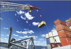  ?? KEY BRIDGE RESPONSE 2024 UNIFIED COMMAND VIA AP ?? IN THIS PHOTO provided by the Key Bridge Response 2024 Unified Command, response crews begin removing shipping containers from the deck of the cargo ship Dali using a floating crane barge at the site of the Francis Scott Key Bridge on Sunday in Baltimore.