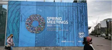  ?? AFPvia Getty Images/Daniel Slim ?? Sign of the times: A billboard advertisin­g the April 5-11 IMF/World Bank spring meetings, which were held remotely due to Covid