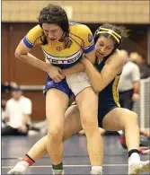  ?? ?? Shafter’s Julissa Gonzalez, right, wrestles in her 139-pound semifinal match against Exeter’s Tiara M. Daly at Saturday night’s Central Section Area II girls wrestling championsh­ips at Golden Valley. Gonzalez won by fall at 4:51.