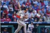  ?? MATT SLOCUM — THE ASSOCIATED PRESS ?? The Braves' Matt Olson follows through after hitting a three-run double off Phillies pitcher Connor Brogdon during the eighth inning of Friday's game in Philadelph­ia.