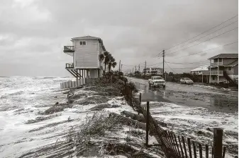  ?? Johnny Milano / New York Times ?? Seawater from Hurricane Dorian inundates a neighborho­od in Vilano Beach, Fla., in 2019. Up and down the coast, rising seas are transformi­ng a fixture of homeowners­hip: the 30-year mortgage.