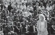  ?? Dirk Heinrich/associated Press ?? First lady Jill Biden greets students while on a visit to Namibia. Biden told the young people that the democracy their parents and grandparen­ts fought for is now theirs to protect.