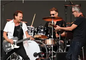  ?? (Gareth Cattermole/getty Images/tns) ?? From left, Eddie Vedder, Matt Cameron and Stone Gossard of Pearl Jam perform onstage in Hyde Park on July 8, 2022, in London.