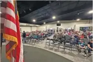  ?? AP PHOTO/SUMMER BALLENTINE ?? Missouri voters gather Saturday at the Family Worship Center of Columbia, Mo., to caucus for the Republican presidenti­al nominee.