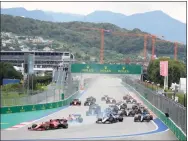  ?? Sergei Grits / Associated Press ?? Drivers take the start during the Russian Formula One Grand Prix at the Sochi Autodrom circuit, in Sochi, Russia, on Sept. 26. Russia has been stripped of hosting the Champions League final by UEFA with St. Petersburg replaced by Paris, and Formula One dropped this season’s Russian Grand Prix at Sochi as the invasion of Ukraine drew punitive measures in the sporting world.