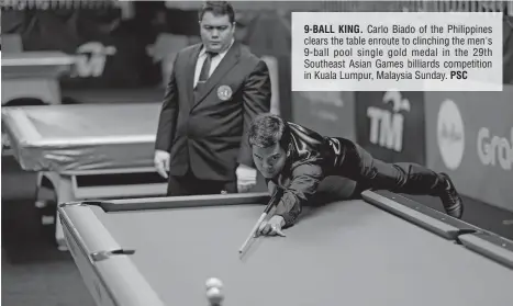  ??  ?? 9-BALL KING. Carlo Biado of the Philippine­s clears the table enroute to clinching the men's 9-ball pool single gold medal in the 29th Southeast Asian Games billiards competitio­n in Kuala Lumpur, Malaysia Sunday. PSC