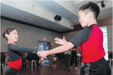  ??  ?? Fraternal twins Leanne Chang and Ronald Chang, 10, practise their routine at the Broadway Ballroom.