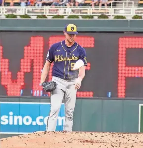  ?? ASSOCIATED PRESS ?? Brewers pitcher Eric Lauer tosses his rosin bag after giving up a two-run home run to the Twins’ Josh Donaldson in the first inning Friday.