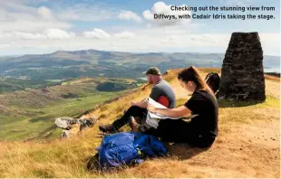  ??  ?? Checking out the stunning view from Diffwys, with Cadair Idris taking the stage.