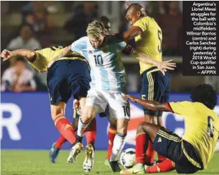  ??  ?? Argentina’s Lionel Messi struggles for the ball with Colombia’s midfielder­s Wilmar Barrios (centre) and Carlos Sanchez (right) during yesterday’s 2018 World Cup qualifier in San Juan. – AFPPIX