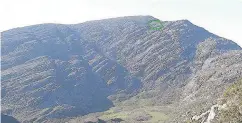  ??  ?? > The location (circled) in the Rhinog Mountains of Snowdonia, where the bodies of all five victims were recovered