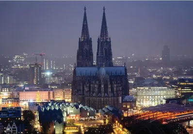  ?? The Associated Press ?? The illuminate­d city center with the Cathedral is seen Tuesday in Cologne, Germany. An unpreceden­ted crisis of confidence is shaking the Archdioces­e of Cologne. Catholic believers have protested their deeply divisive bishop and are leaving in droves over allegation­s that he may have covered up clergy sexual abuse reports.