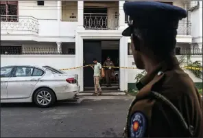  ?? The New York Times/ADAM DEAN ?? Police work at a safe house Tuesday in Colombo, Sri Lanka, where suspects in Sunday’s bombing attacks were arrested in a raid. The government said Monday that it had arrested 40 people in the attacks, all of them Sri Lankans.