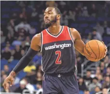  ?? KIM KLEMENT, USA TODAY SPORTS ?? Point guard John Wall has the Wizards in the hunt in the East.