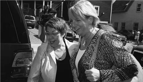  ?? ANDREW VAUGHAN / THE CANADIAN PRESS ?? Nunavut Premier Eva Aariak, left, and Newfoundla­nd and Labrador Premier Kathy Dunderdale arrive for a meeting in Lunenburg,N.S., last July 25. The territory desperatel­y needs 300 more Inuktitut language teachers for its schools, Aariak says.