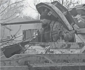  ?? GENYA SAVILOV/AFP VIA GETTY IMAGES ?? A Ukrainian serviceman of the 47th Mechanized Brigade prepares for combat in a Bradley fighting vehicle, not far from Avdiivka, in the Donetsk region, on Feb. 11, amid the Russian invasion of Ukraine.