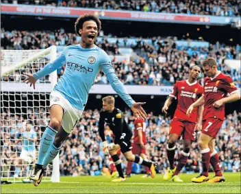  ?? Picture: REUTERS ?? TOO EASY: Manchester City’s Leroy Sane scores their fourth goal against Liverpool