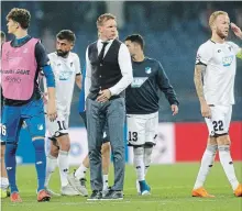  ?? EFREM LUKATSKY THE ASSOCIATED PRESS ?? Hoffenheim coach Julian Nagelsmann, centre, looks on at the end of a Group F Champions League soccer match against Shakhtar Donetsk in Kharkiv, Ukraine, on Wednesday. The teams played to a 2-2 draw.