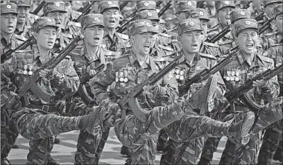  ?? [WONG MAYE-E/THE ASSOCIATED PRESS] ?? North Korean soldiers march across Kim Il Sung Square during a military parade April 15 in Pyongyang.