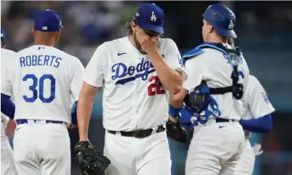  ?? ?? Clayton Kershaw reacts after a terrible first inning against the Arizona Diamondbac­ks. Photograph: Ashley Landis/AP